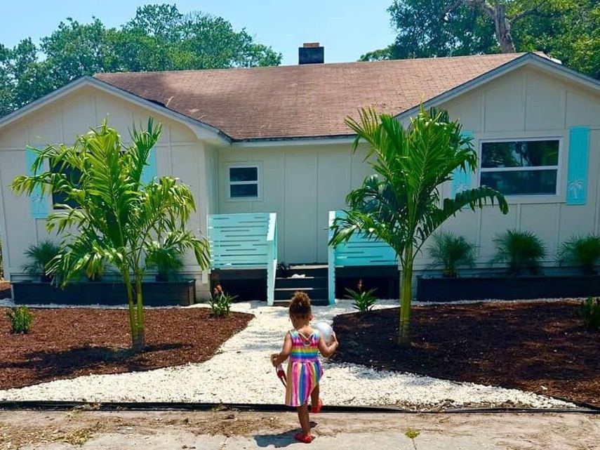 Front of a C.A.L.I. Project home with turquoise accents