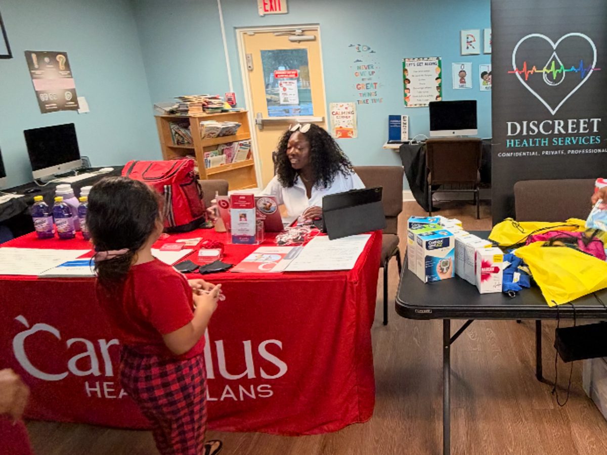 Health insurance and wellness services table at S.O.S.