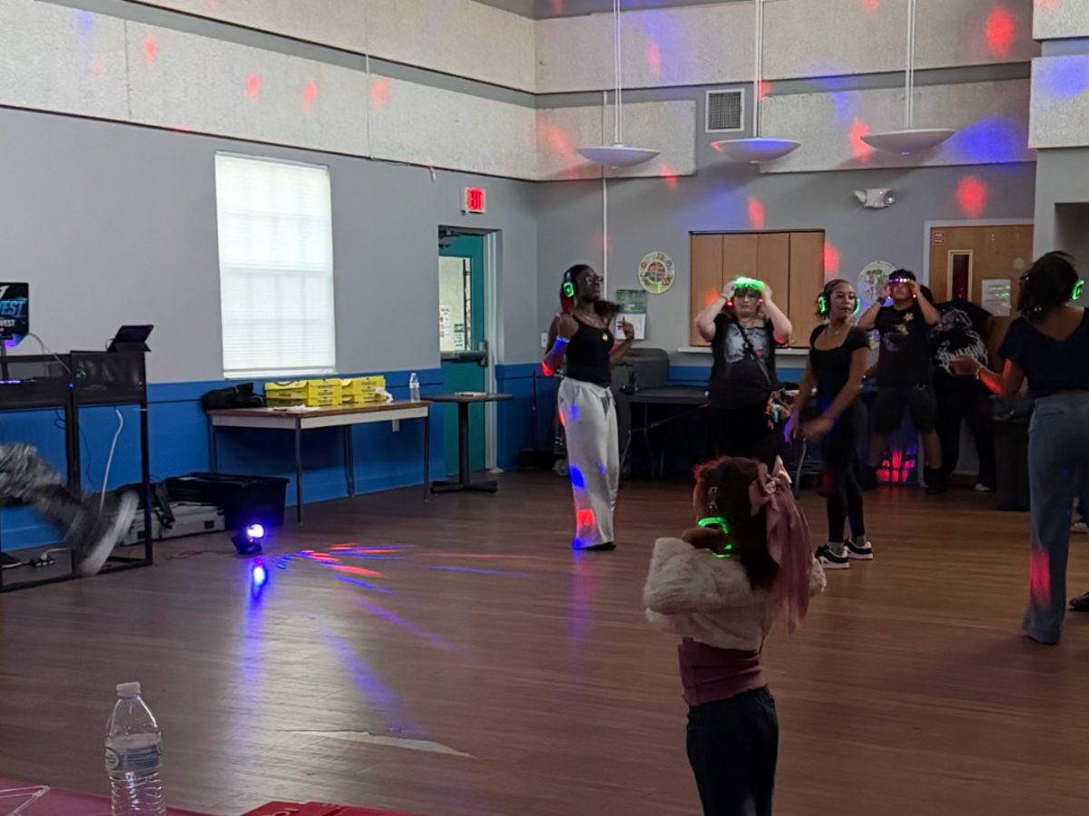 Silent disco dance party with glowing headphones
