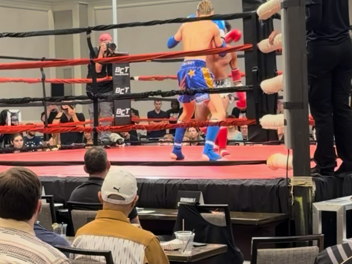 Teens watching a live kickboxing match
