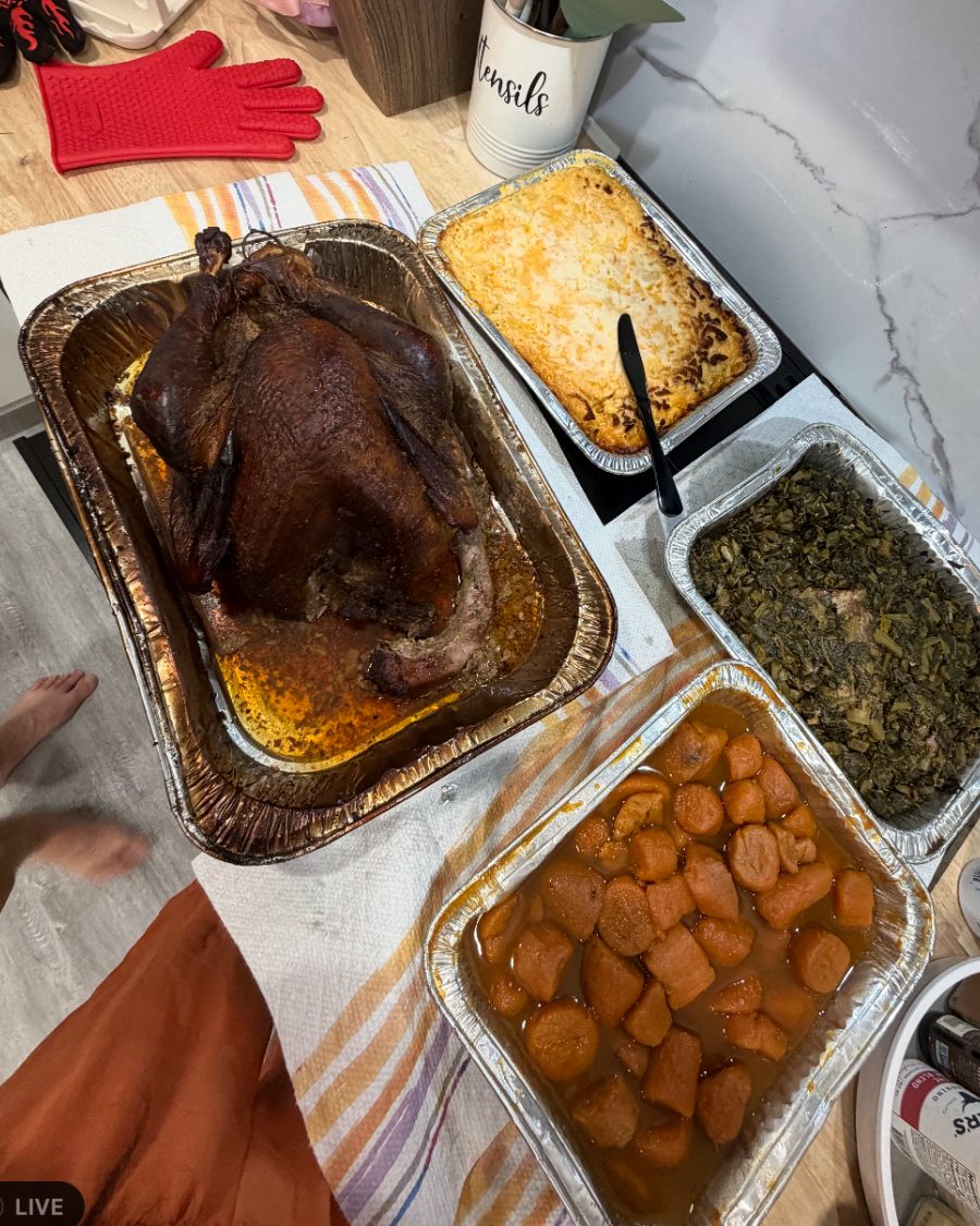 Thanksgiving turkey dinner with yams, greens and mac and cheese